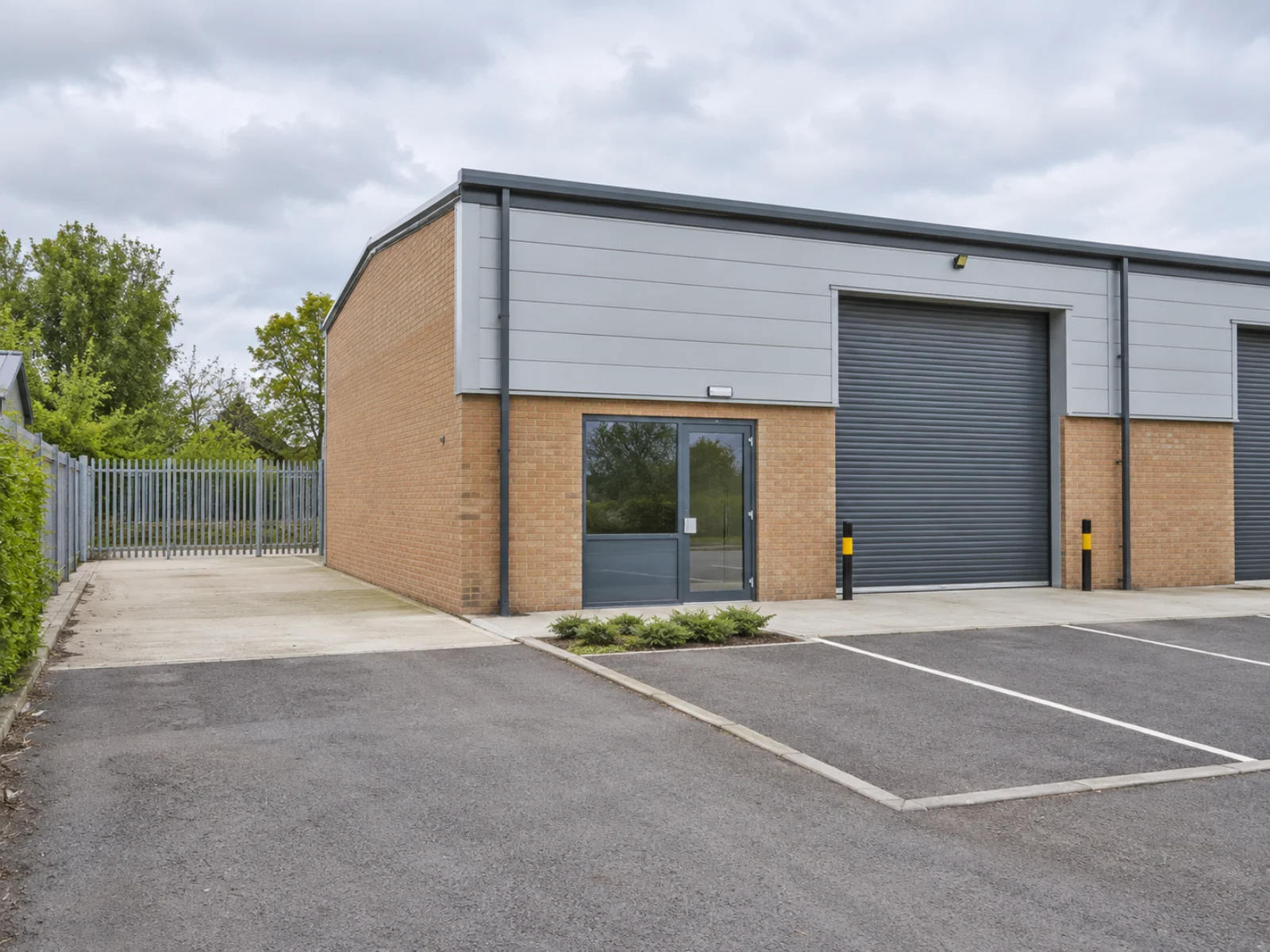 Small workshop unit with roller shutter and parking